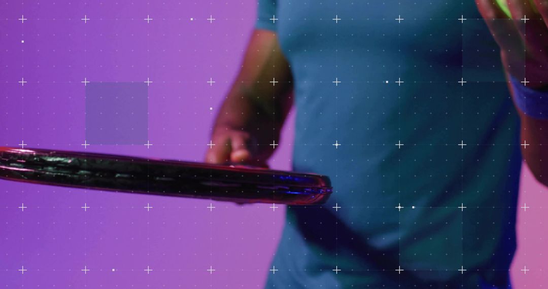 Man Holding Racket Rim Gesturing Toward Green Ball with Neon Magenta and Teal Lighting