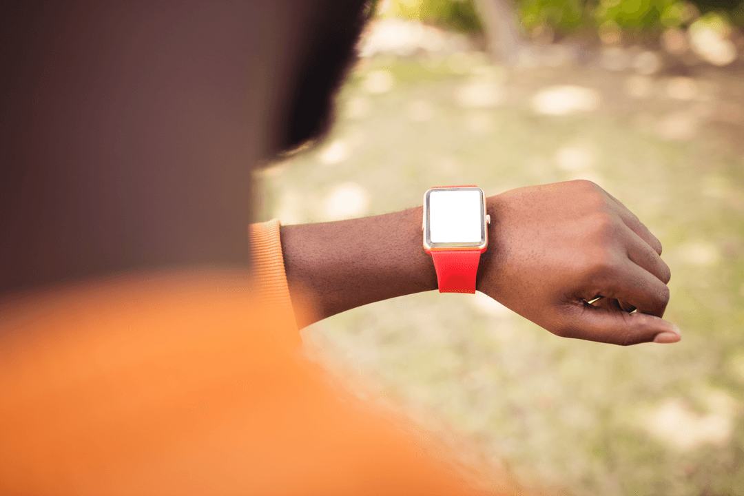 Close-up of Man Checking Transparent Smartwatch Outdoors