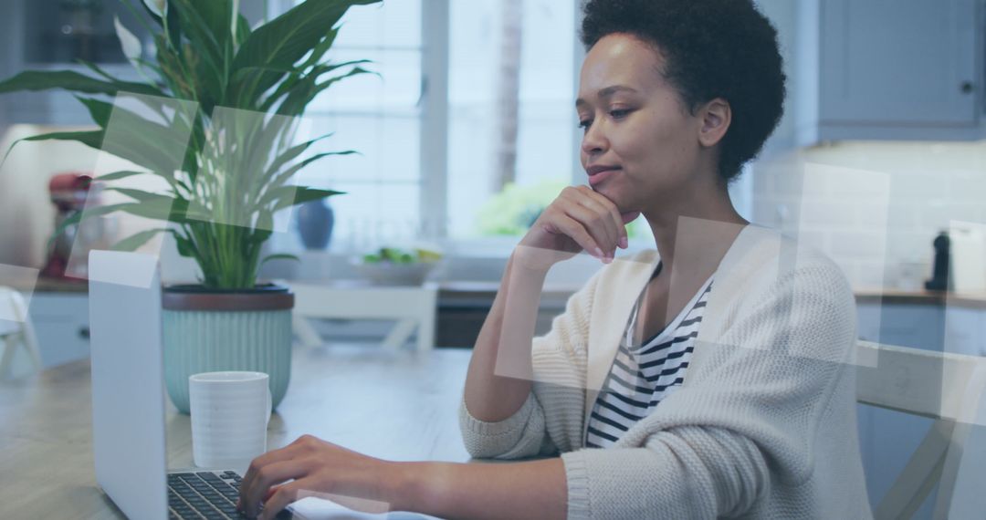 Focused Woman Working from Home on Laptop in Bright Room