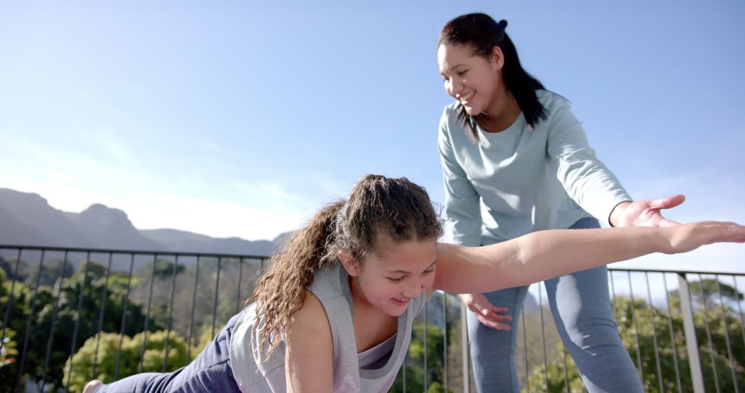 Mother and Daughter Enjoying Outdoor Yoga Session Together - Free Images, Stock Photos and Pictures on Pikwizard.com