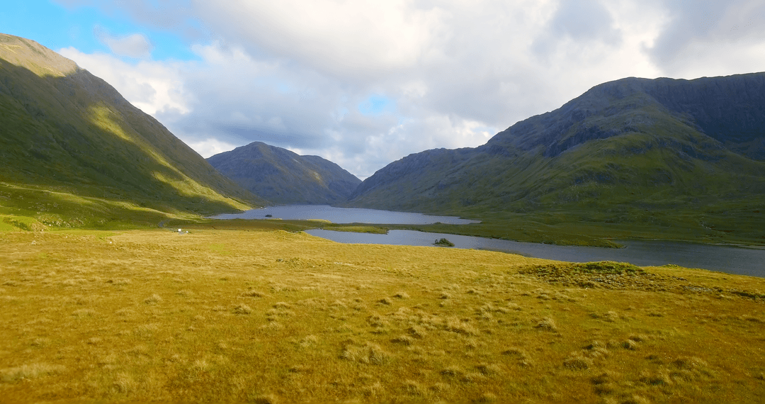 Scenic Landscape with Transparent Morning Lake and Mountain Sky