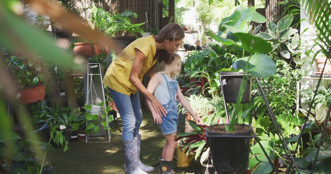 Mother and Daughter Bonding in Lush Greenhouse