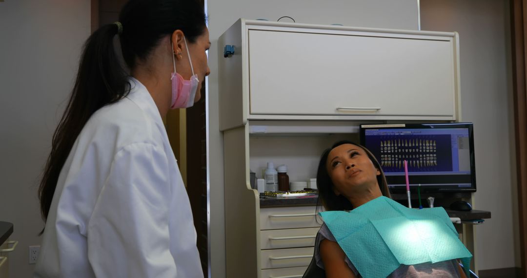 Dentist Attending to Patient in Modern Dental Clinic - Free Images, Stock Photos and Pictures on Pikwizard.com