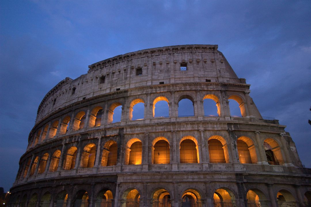 Historic Roman Colosseum Illuminated at Dusk - Free Images, Stock Photos and Pictures on Pikwizard.com