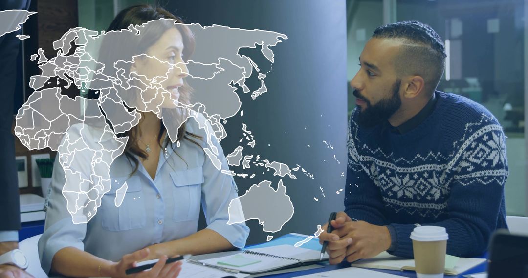 Multicultural Team Analyzing Global Business Strategy in Modern Office