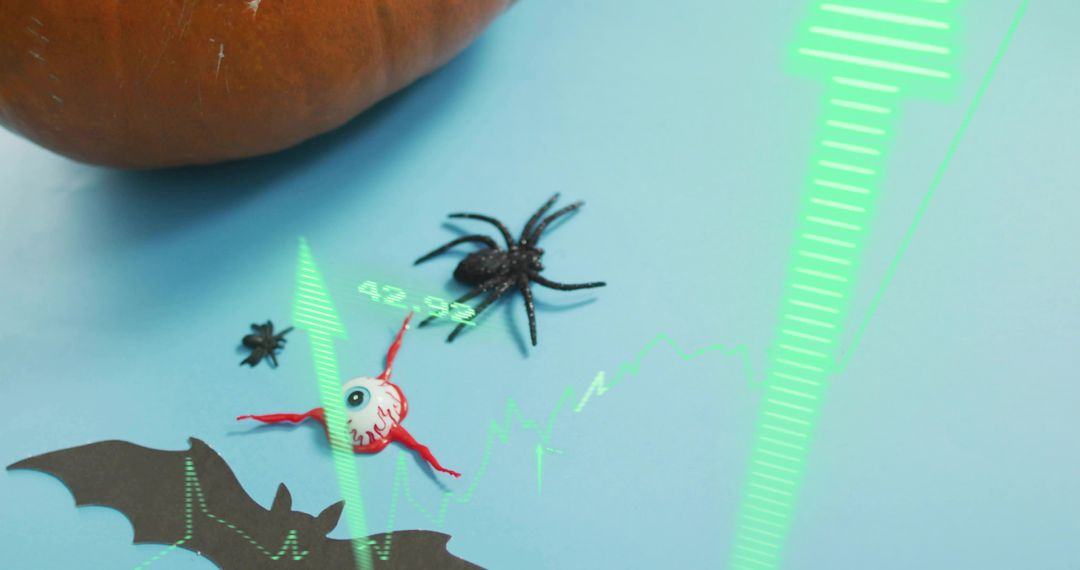 Augmented reality Halloween scene with toy eyeball, spider, pumpkin and green overlay