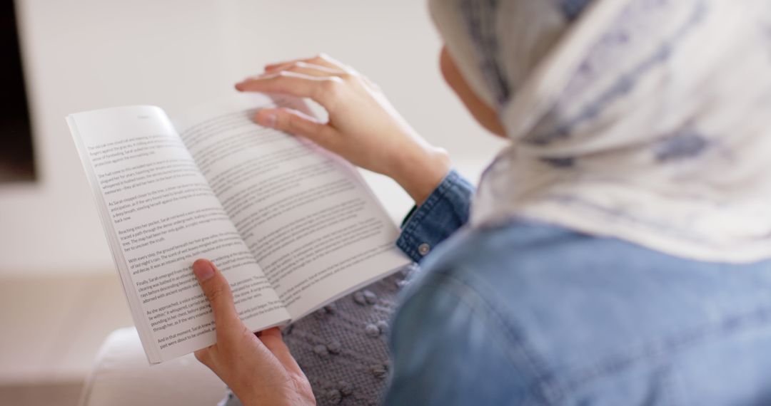 Muslim Woman Reading Book at Home - Free Images, Stock Photos and Pictures on Pikwizard.com