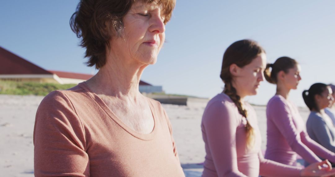 Group of Women Practicing Yoga and Meditation on Beach - Free Images, Stock Photos and Pictures on Pikwizard.com