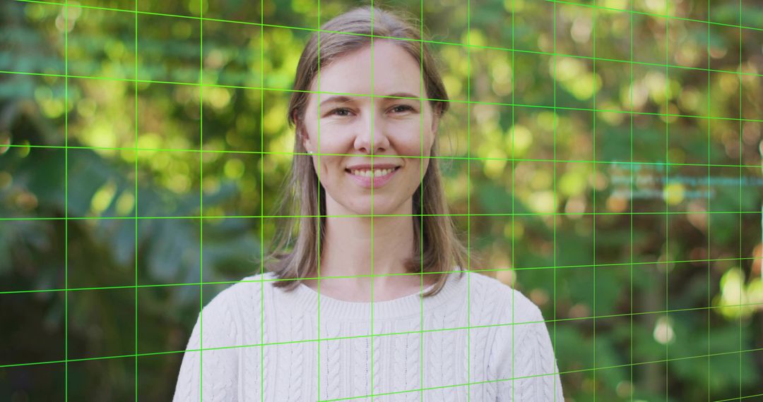 Smiling woman in sweater with green grid overlay standing in lush garden