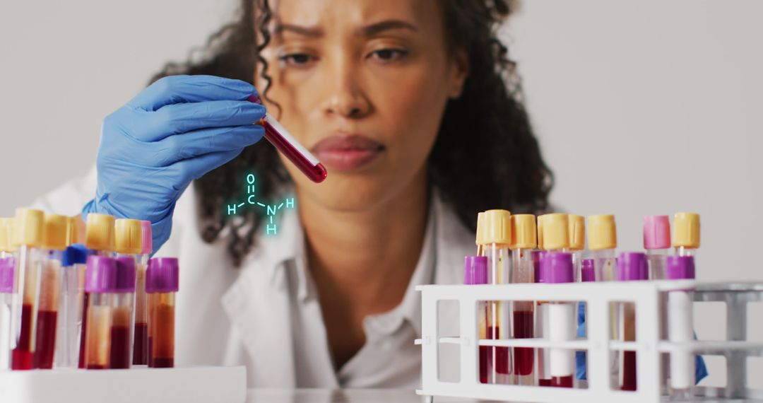 Biracial Doctor Analyzing Blood Samples in Laboratory