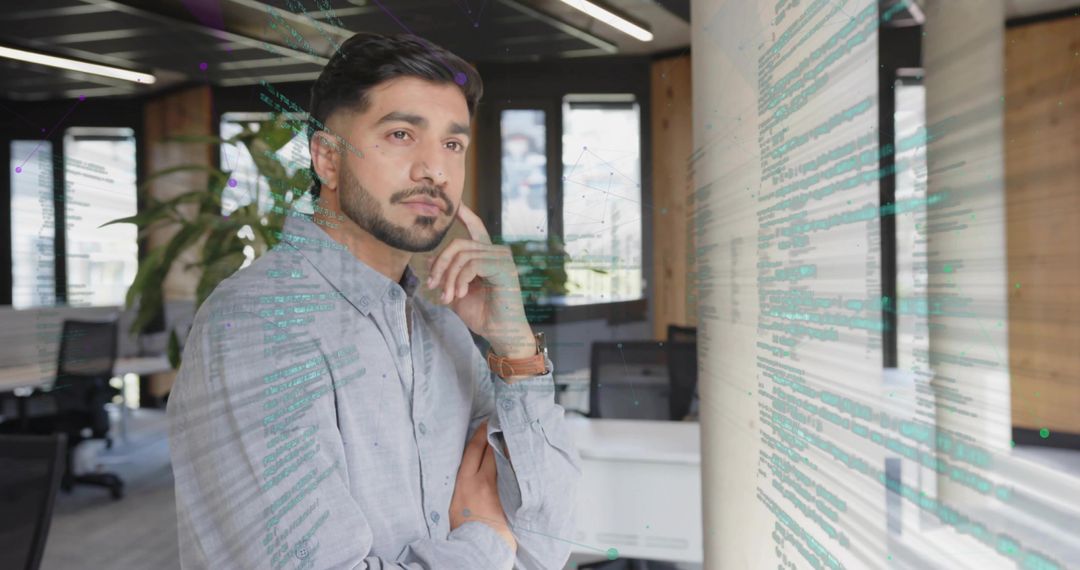 Pensive Professional in High-Tech Workspace Environment