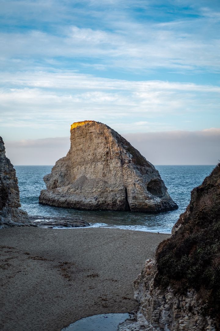 Scenic beach vista with majestic coastal rock formation