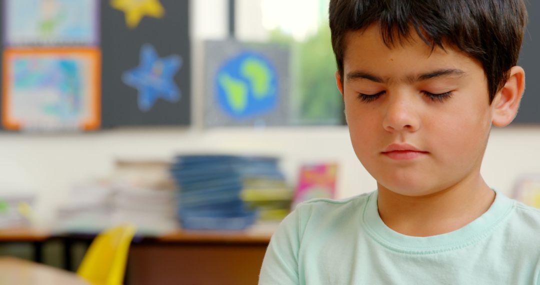 Child Practicing Mindfulness in Classroom Setting