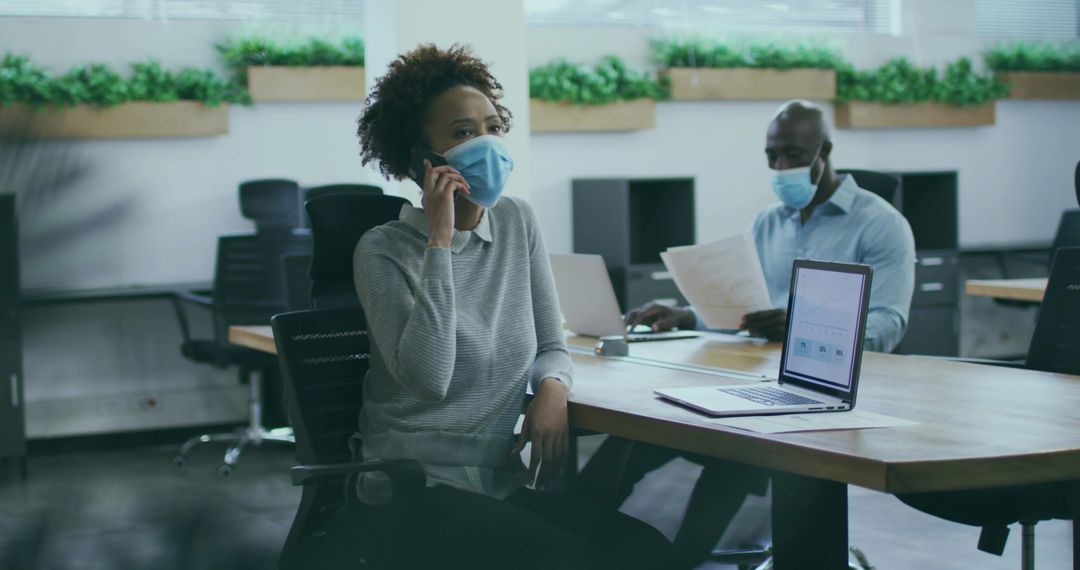 Office Meeting with Laptops While Wearing Face Masks