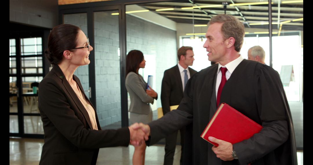 Diverse Professionals Shaking Hands at Legal Business Meeting