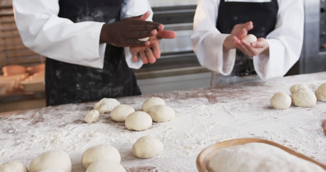 Professional Bakers Preparing Dough Balls in Bakery - Free Images, Stock Photos and Pictures on Pikwizard.com