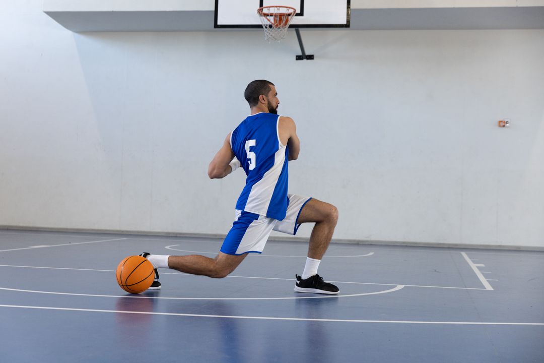 Basketball Player Practicing Lunges on Indoor Court
