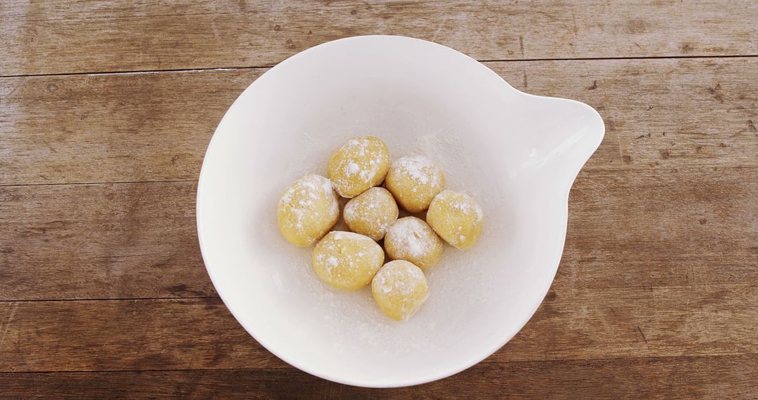 Dough Balls with Flour in White Bowl on Wooden Surface - Free Images, Stock Photos and Pictures on Pikwizard.com