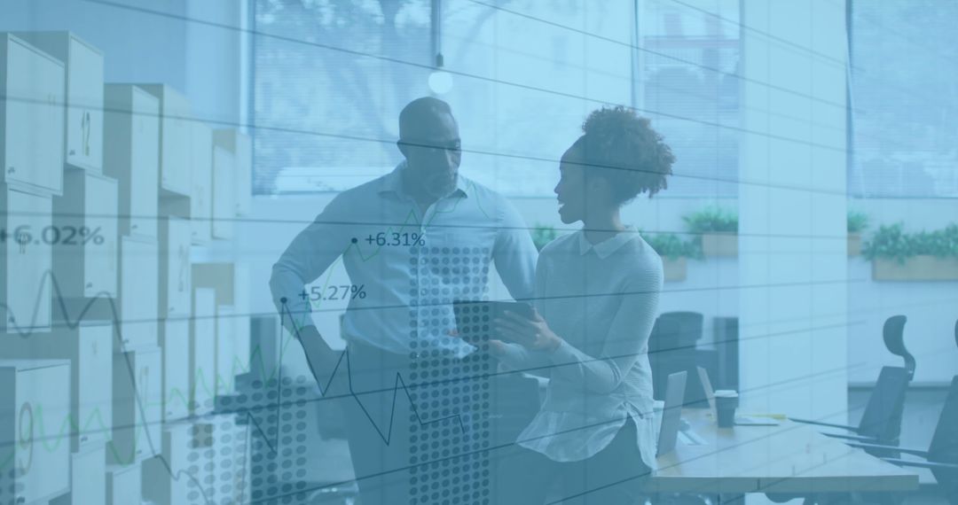 Business Professionals Analyzing Financial Data Charts in Office