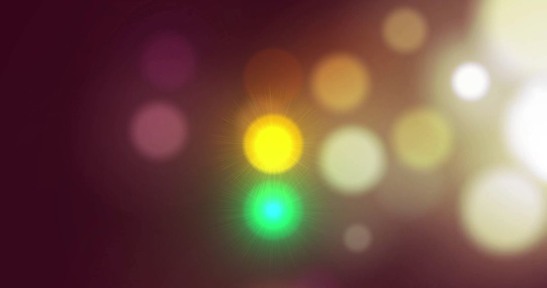 Colorful Glowing Light Orbs with Bokeh Effects on Dark Background
