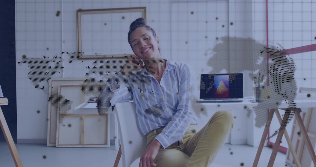 Creative Entrepreneur Smiling in Bright Art Studio