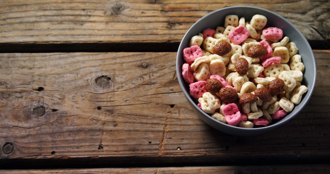 Colorful Breakfast Cereal in Bowl on Rustic Wooden Table - Free Images, Stock Photos and Pictures on Pikwizard.com