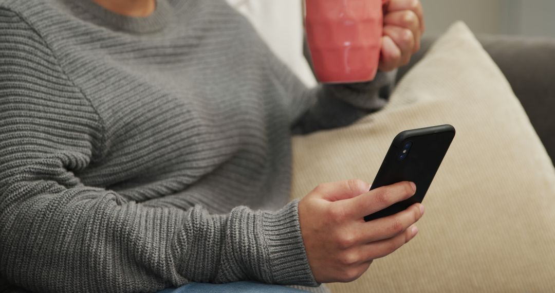 Person Relaxing with Smartphone and Coffee Cup at Home - Free Images, Stock Photos and Pictures on Pikwizard.com