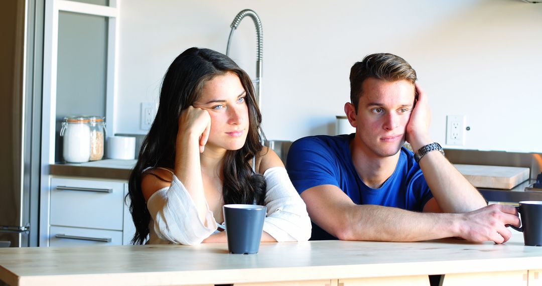 Thoughtful Couple Contemplating in Modern Kitchen