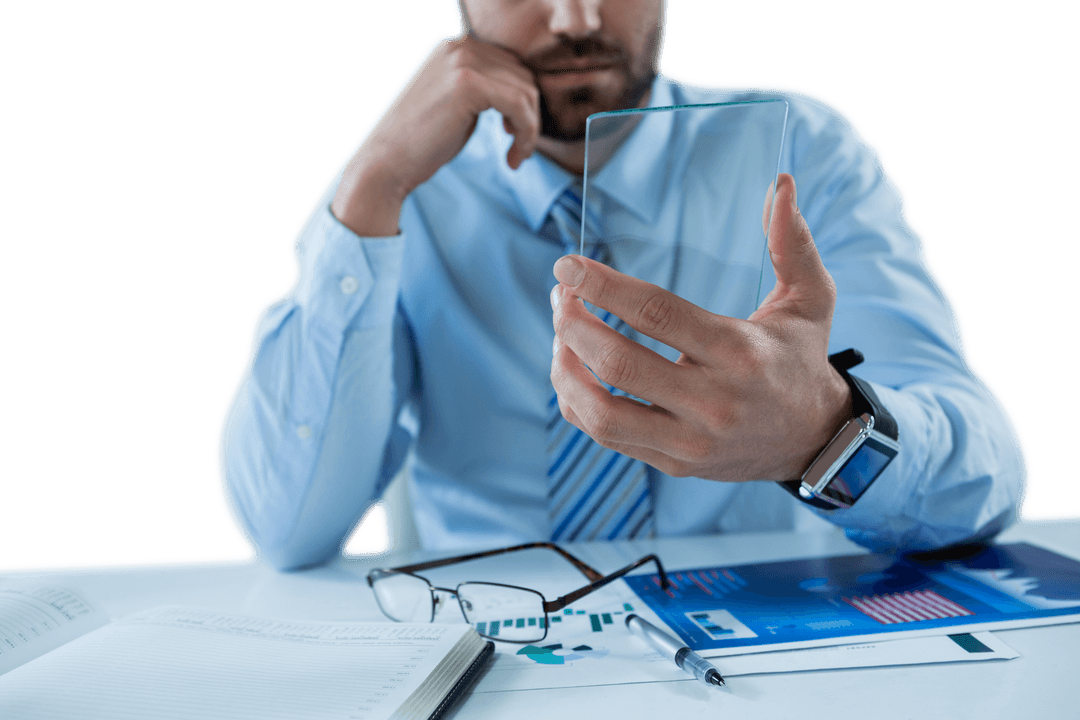 Businessman Holding Transparent Glass Device at Desk