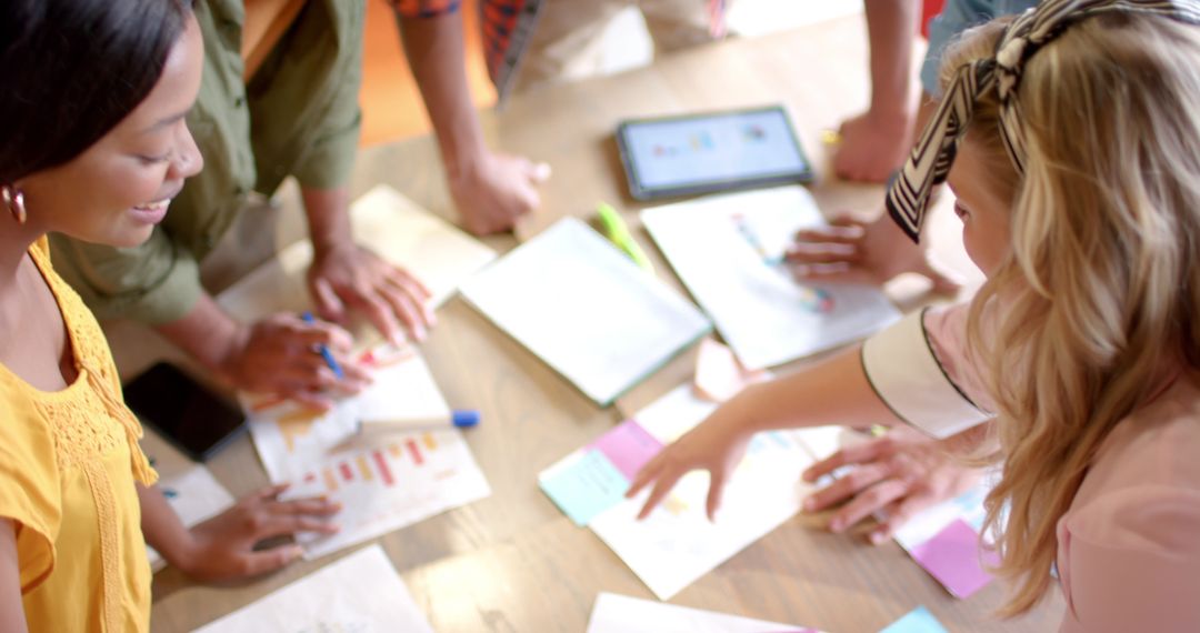 Diverse Team Brainstorming with Sticky Notes in Bright Office