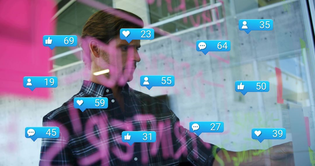 Man pointing at glass board with social notifications overlay during brainstorming session