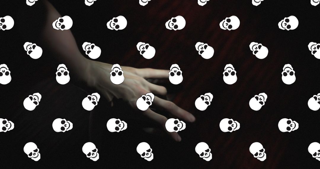 Horror Skulls Floating Over Mysterious Hand in Dark Space