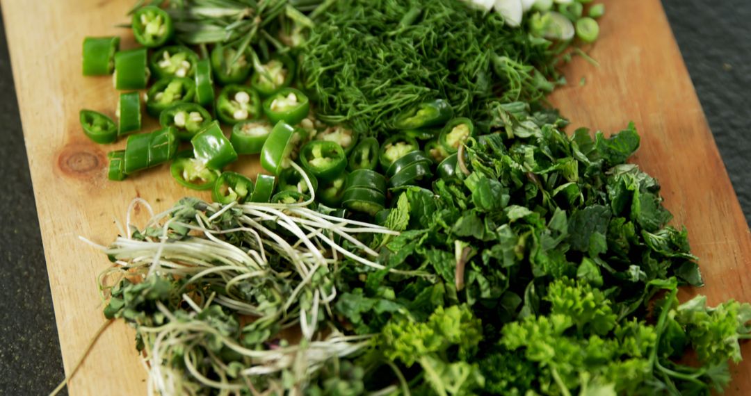 Freshly Chopped Herbs and Vegetables on Wooden Board - Free Images, Stock Photos and Pictures on Pikwizard.com