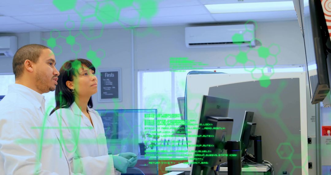 Scientists Analyzing Data on Monitors in Advanced Laboratory