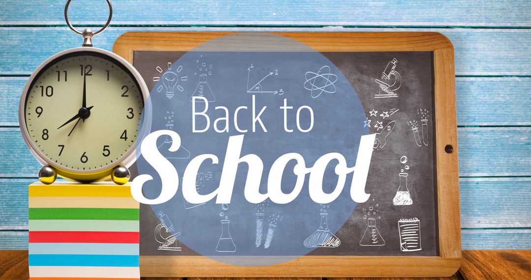 Back to School Chalkboard with Alarm Clock and Stationery
