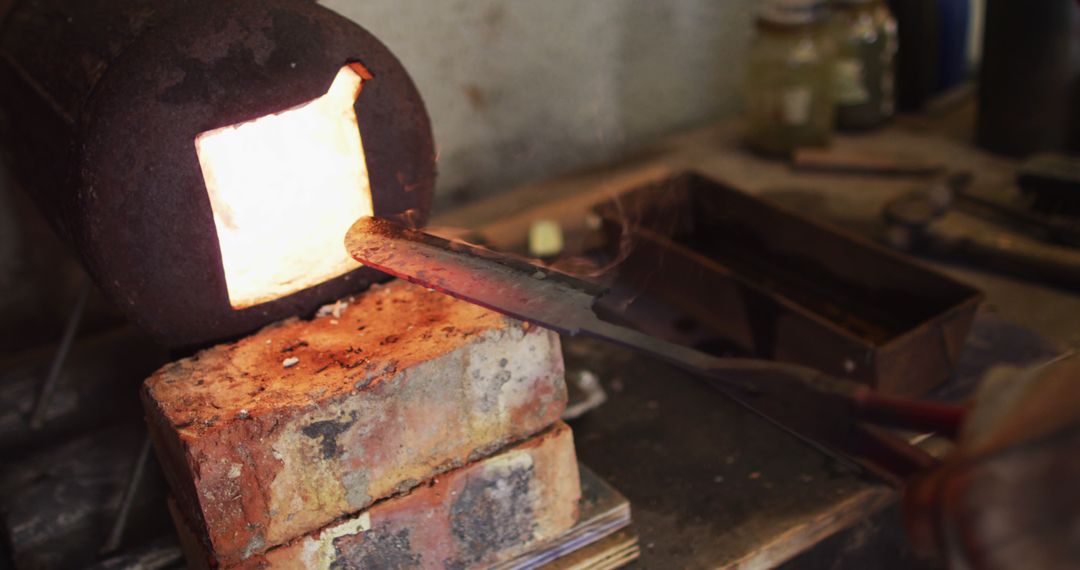 Blacksmith Heating Metal in Furnace During Sword Forging - Free Images, Stock Photos and Pictures on Pikwizard.com