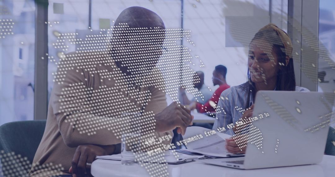 Diverse Team Collaborating Over Documents with Digital World Map Overlay