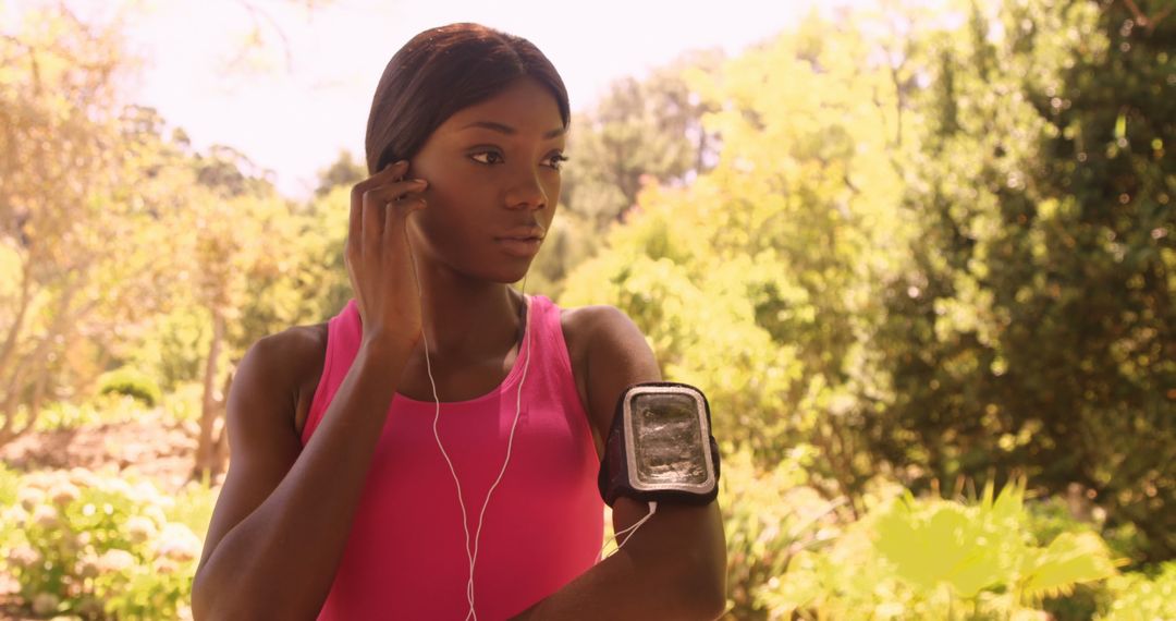 Focused Runner Preparing in Vibrant Park Setting