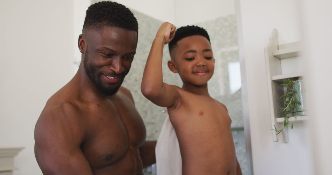 Happy Shirtless African-American Father and Son in Bathroom - Free Images, Stock Photos and Pictures on Pikwizard.com