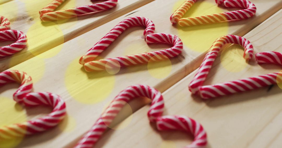Candy Cane Heart Shapes on Wooden Surface With Bokeh Lights