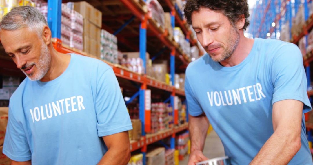 Volunteers Organizing Food Donations at Warehouse - Free Images, Stock Photos and Pictures on Pikwizard.com