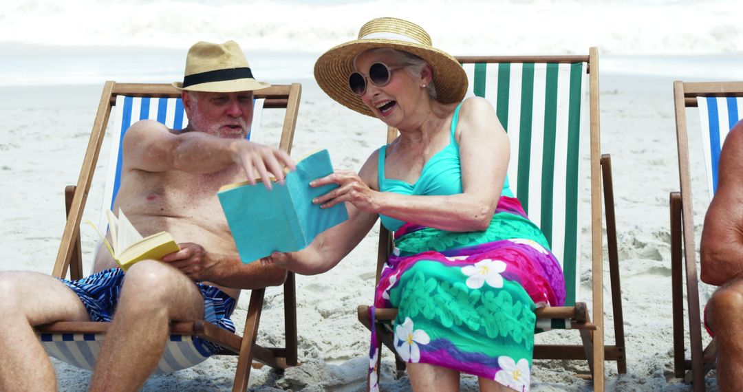 Elderly Couple Relaxing on Beach Loungers Reading Books - Free Images, Stock Photos and Pictures on Pikwizard.com