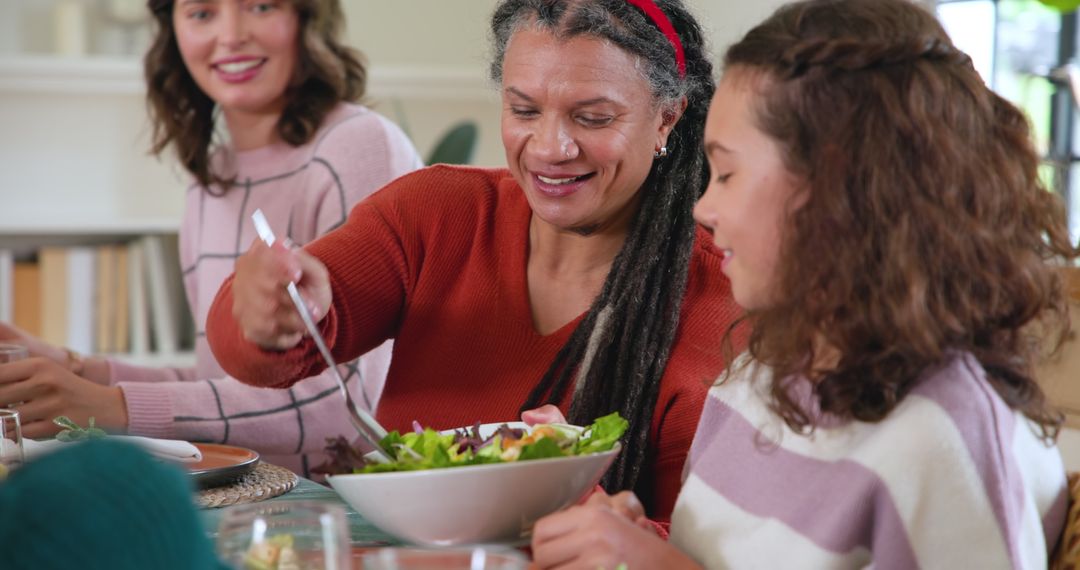 Family Gathering Enjoying a Meal at Cozy Home Dining Table