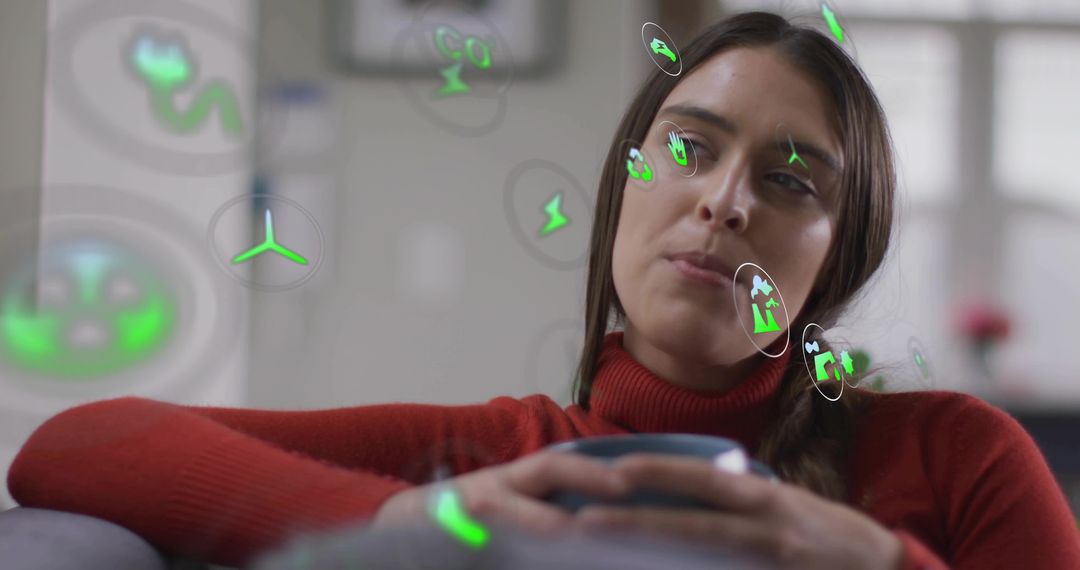Young woman contemplating with AR sustainability icons while relaxing on couch