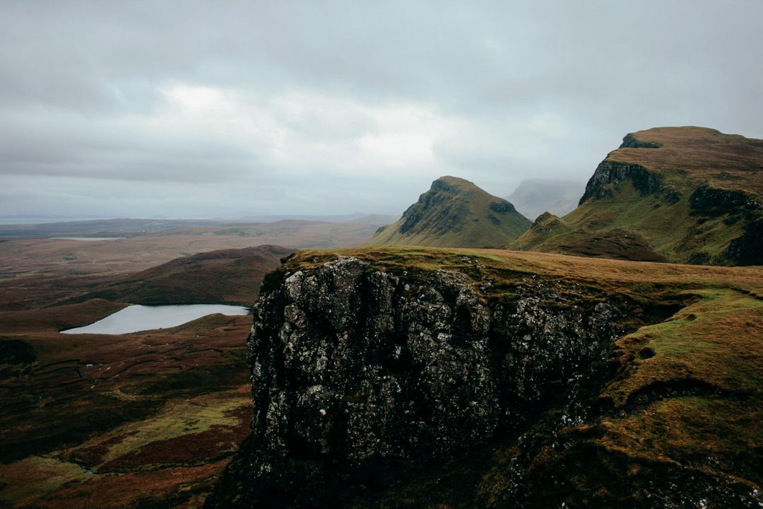 Misty Mountain Range with Lakes and Cliffs in Scottish Highlands - Free Images, Stock Photos and Pictures on Pikwizard.com