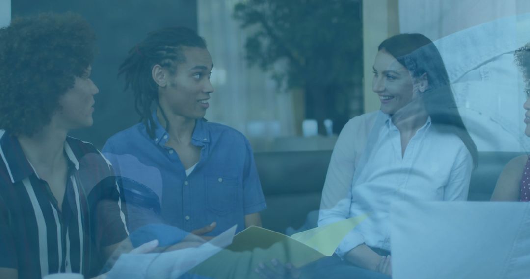 Diverse Colleagues Collaborating in Modern Lounge Area