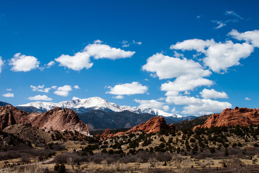 Rugged Red Rock Formations with Snow Capped Mountains - Free Images, Stock Photos and Pictures on Pikwizard.com