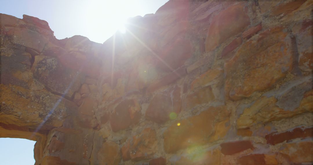 Sunlight Shining through Ancient Stone Wall Ruins - Free Images, Stock Photos and Pictures on Pikwizard.com