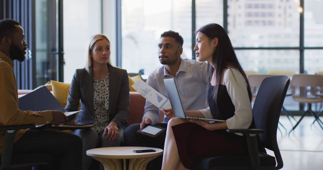 Diverse Colleagues Having Informal Meeting at Office Sundown