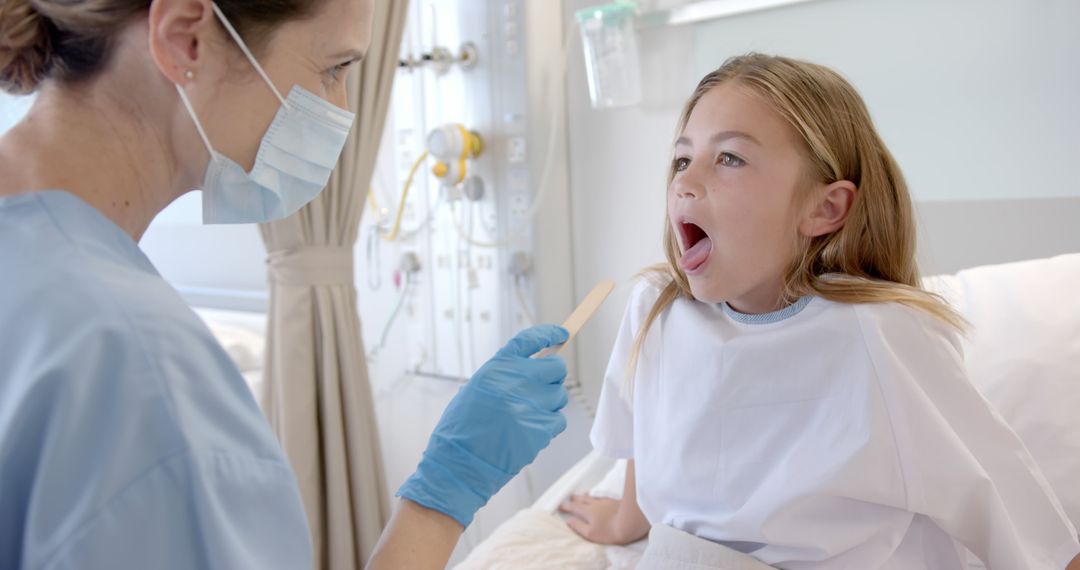 Female Doctor Examining Throat of Young Girl in Hospital - Free Images, Stock Photos and Pictures on Pikwizard.com